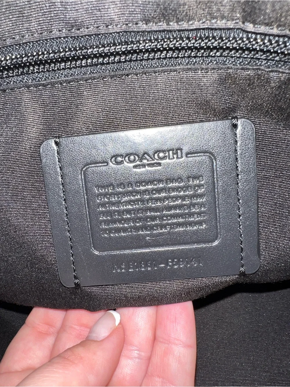 Coach sleek black